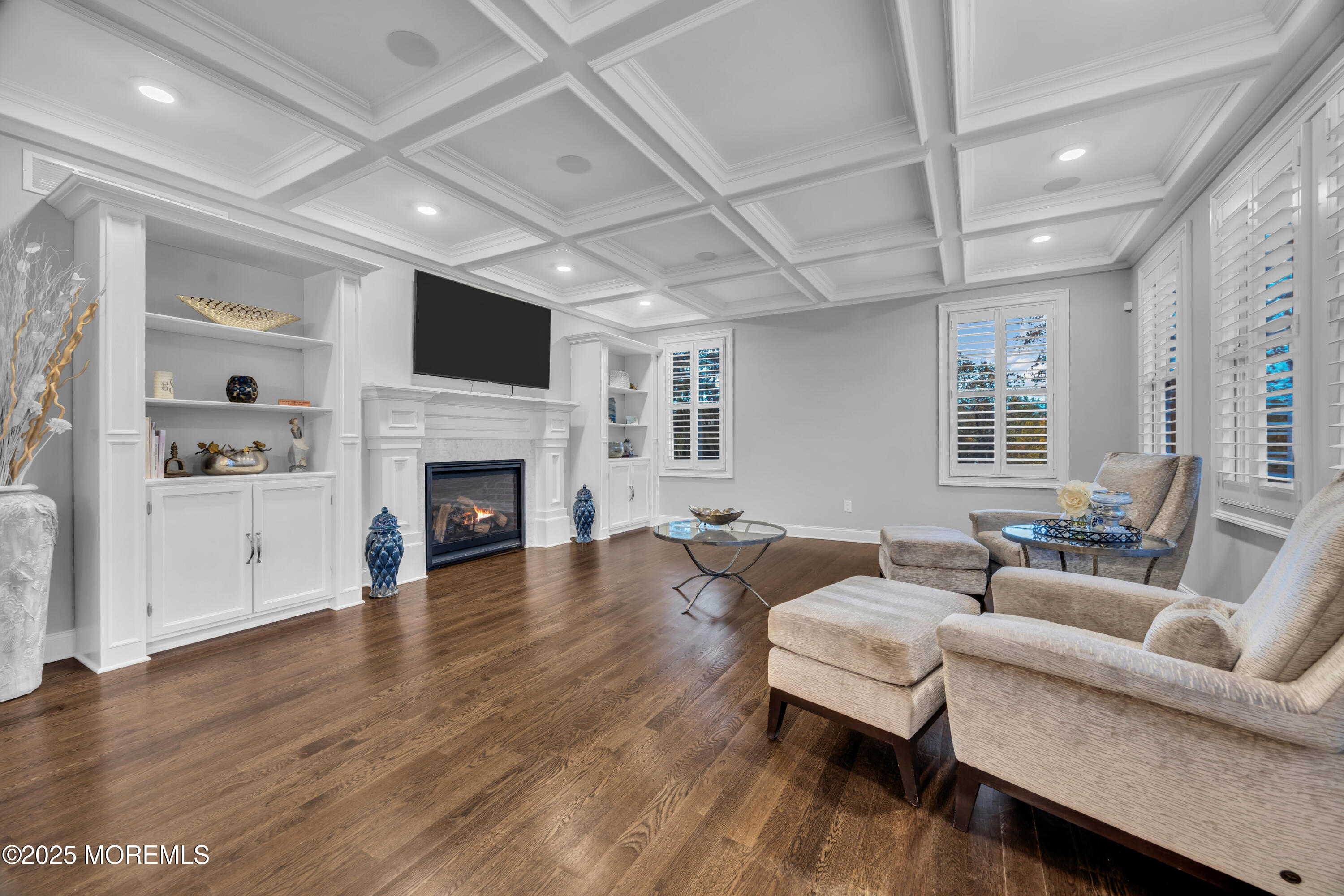 145 Heulitt Road Colts Neck, NJ 07722 - Photo 16 of 59 a living room with furniture fireplace and flat screen tv