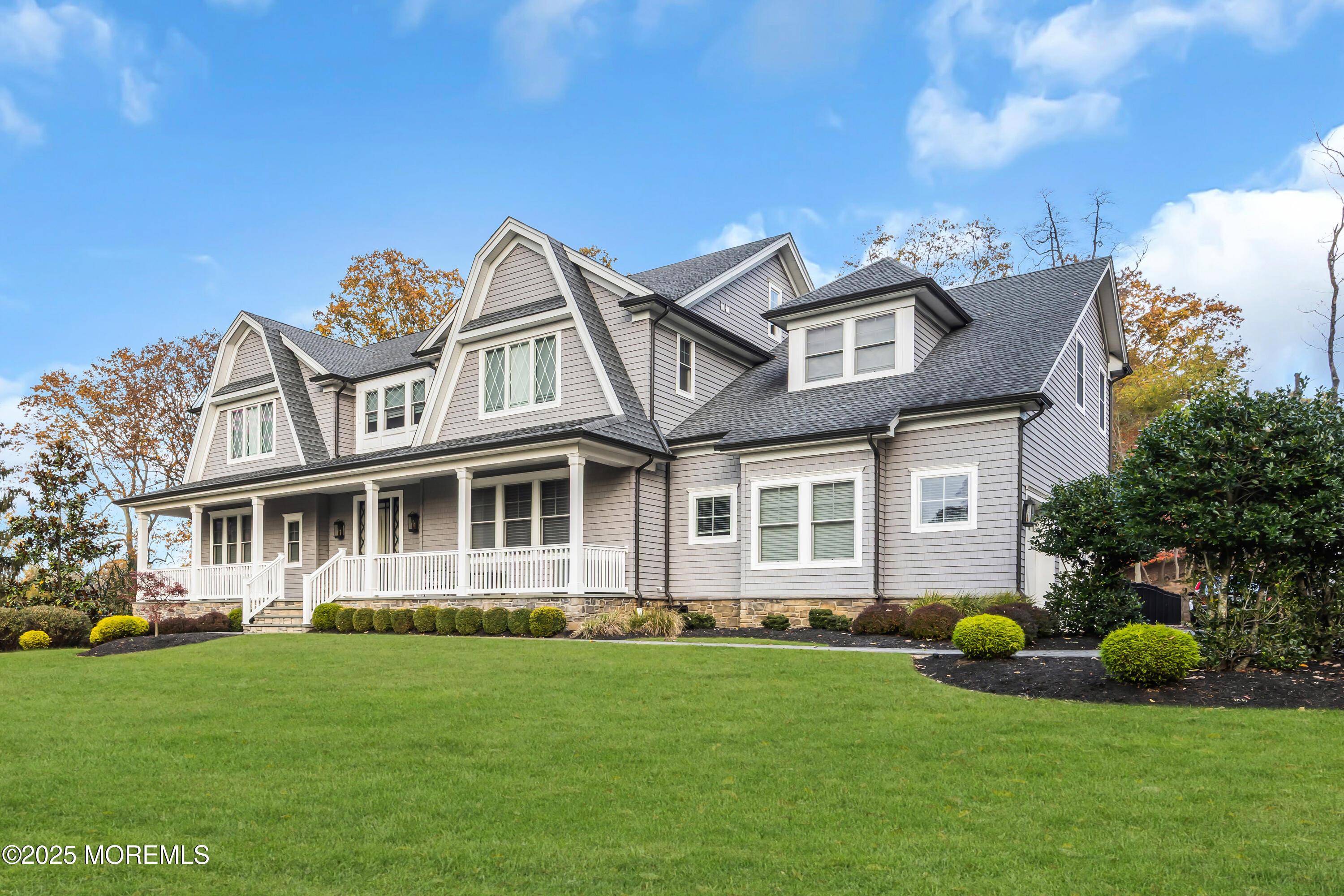 145 Heulitt Road Colts Neck, NJ 07722 - Photo 2 of 59 a front view of a house with a garden and plants