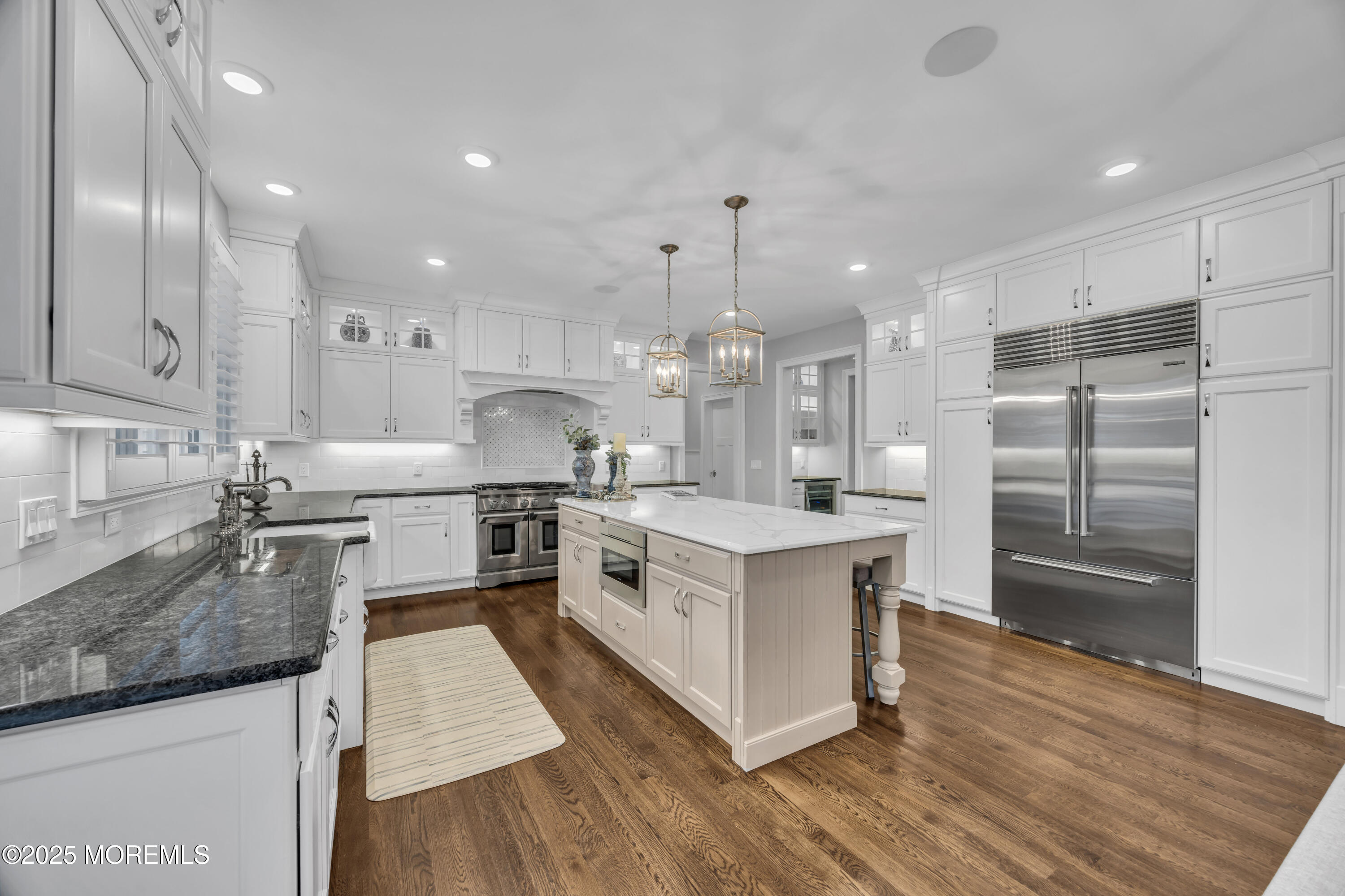 145 Heulitt Road Colts Neck, NJ 07722 - Photo 21 of 59 a large kitchen with stainless steel appliances kitchen island granite countertop a large counter top a sink stainless steel appliances and cabinets