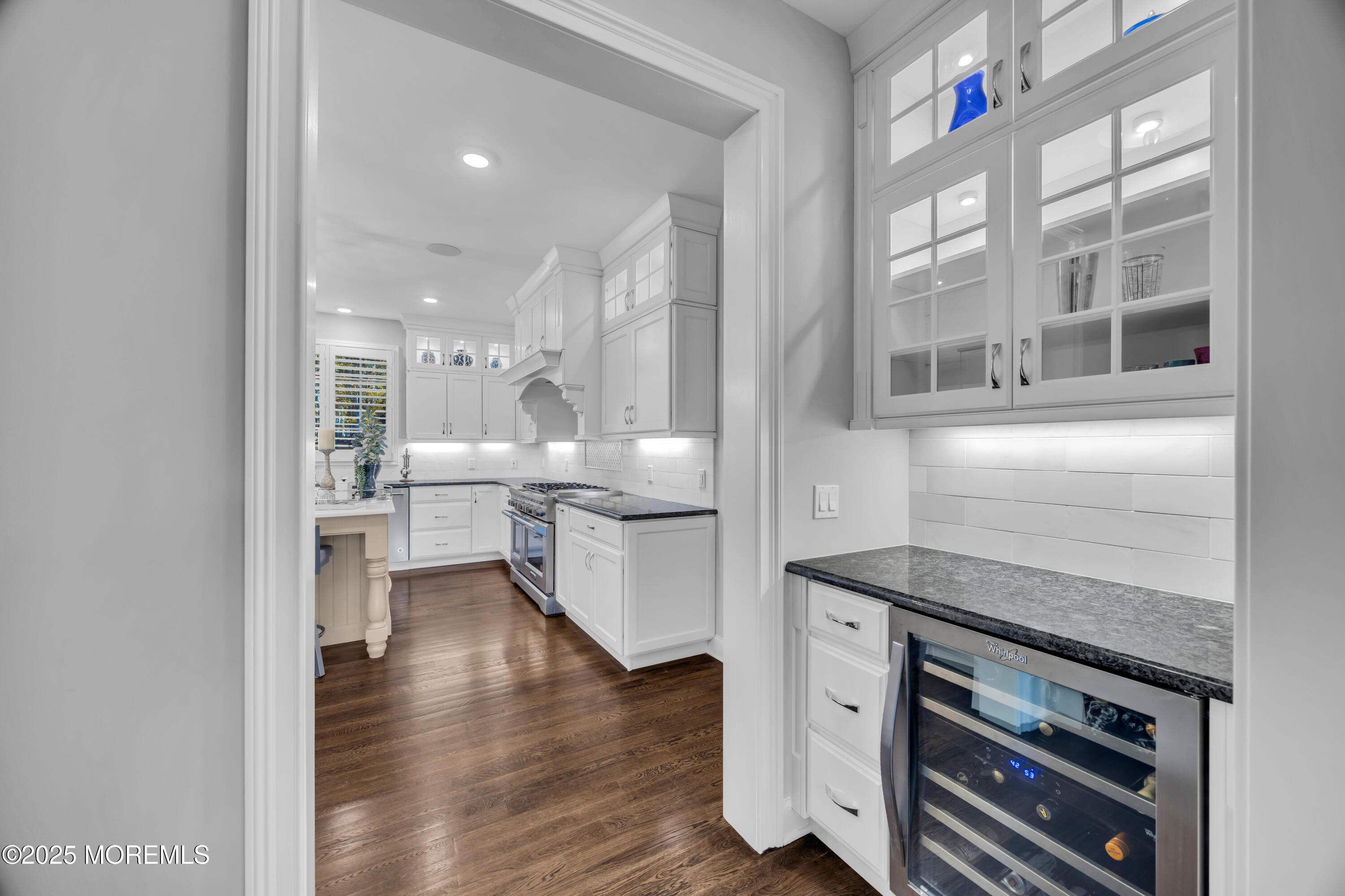 145 Heulitt Road Colts Neck, NJ 07722 - Photo 24 of 59 a kitchen with stainless steel appliances granite countertop a stove and a view of living room