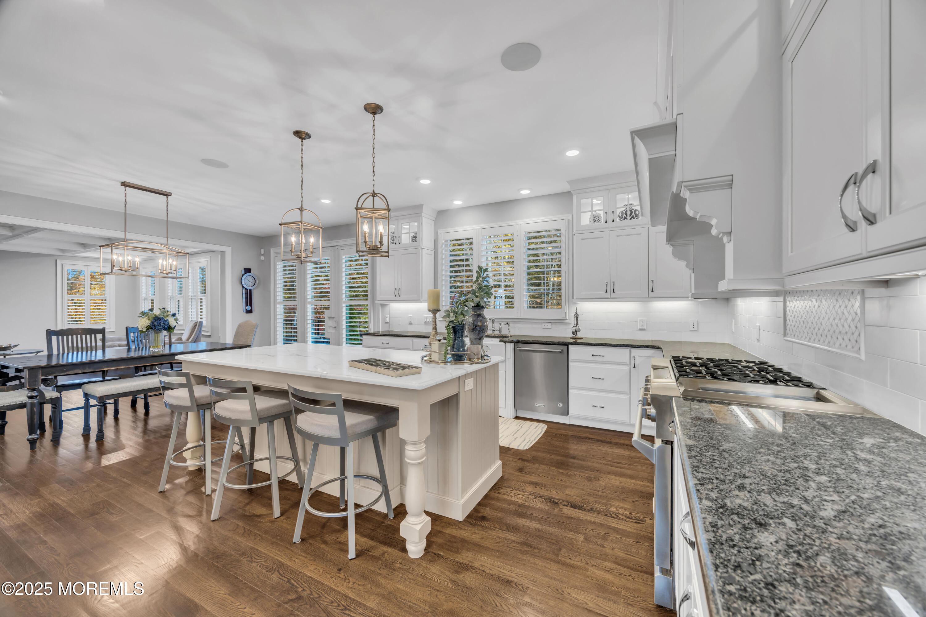 145 Heulitt Road Colts Neck, NJ 07722 - Photo 26 of 59 a kitchen with a table chairs stove and cabinets