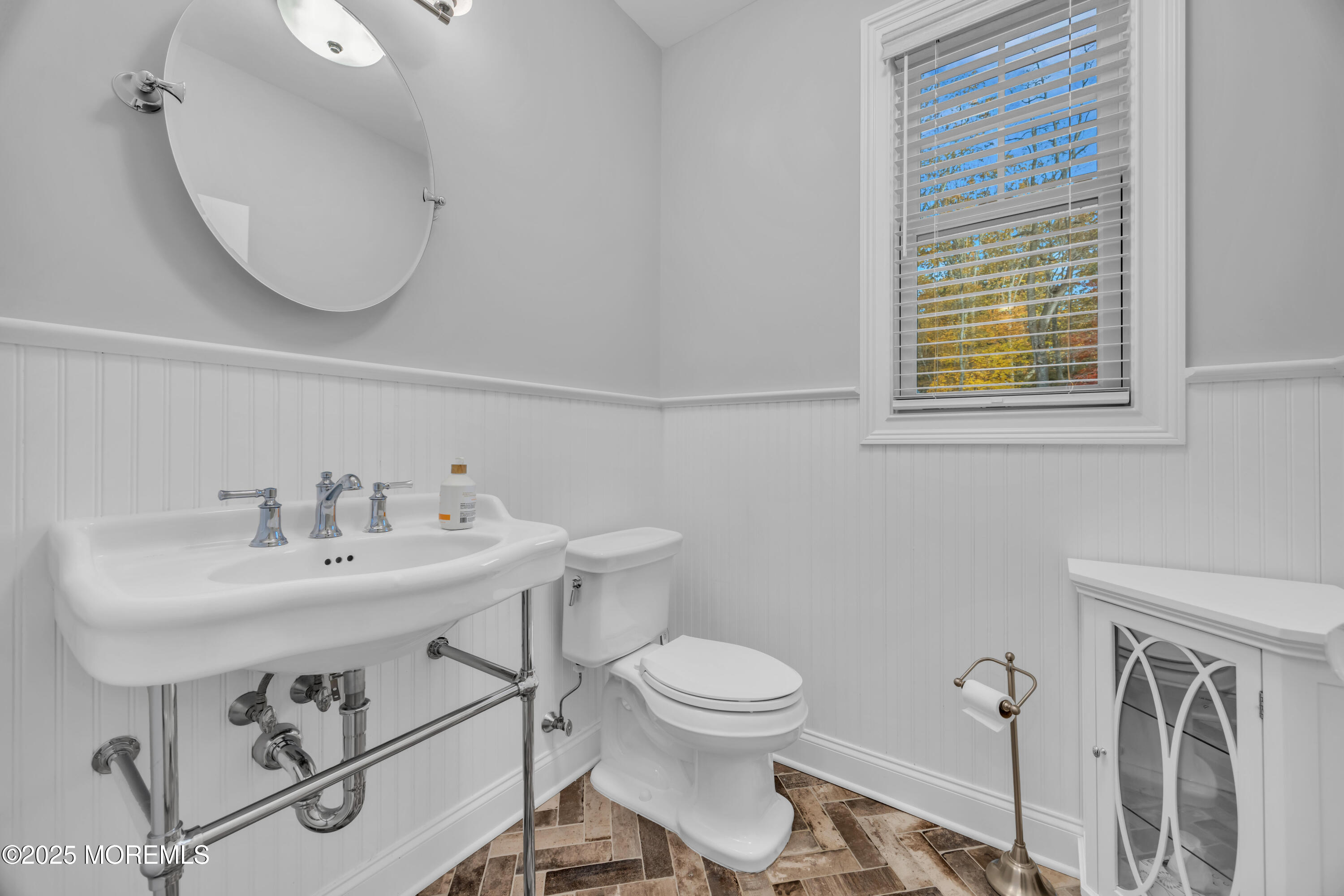 145 Heulitt Road Colts Neck, NJ 07722 - Photo 29 of 59 a bathroom with a sink a toilet and a mirror