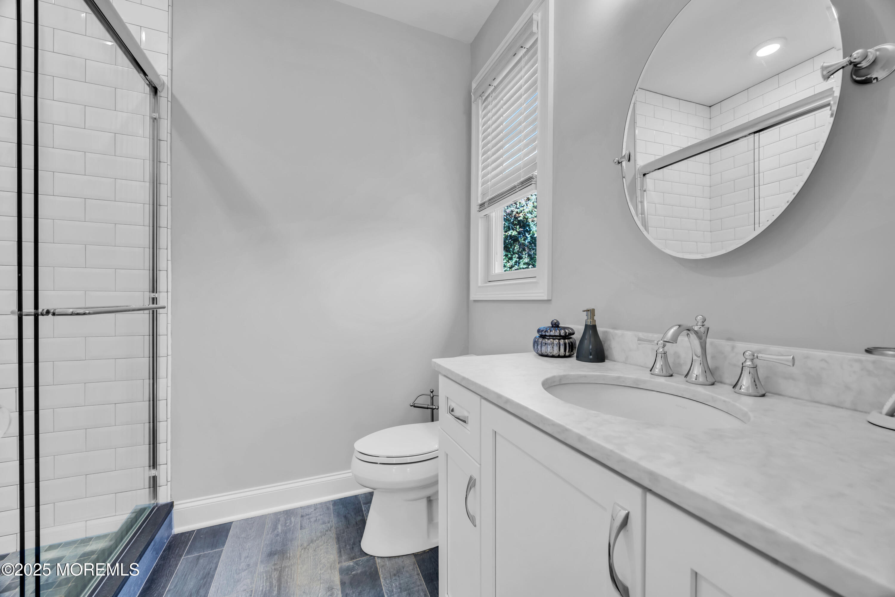145 Heulitt Road Colts Neck, NJ 07722 - Photo 36 of 59 a bathroom with a toilet sink and mirror