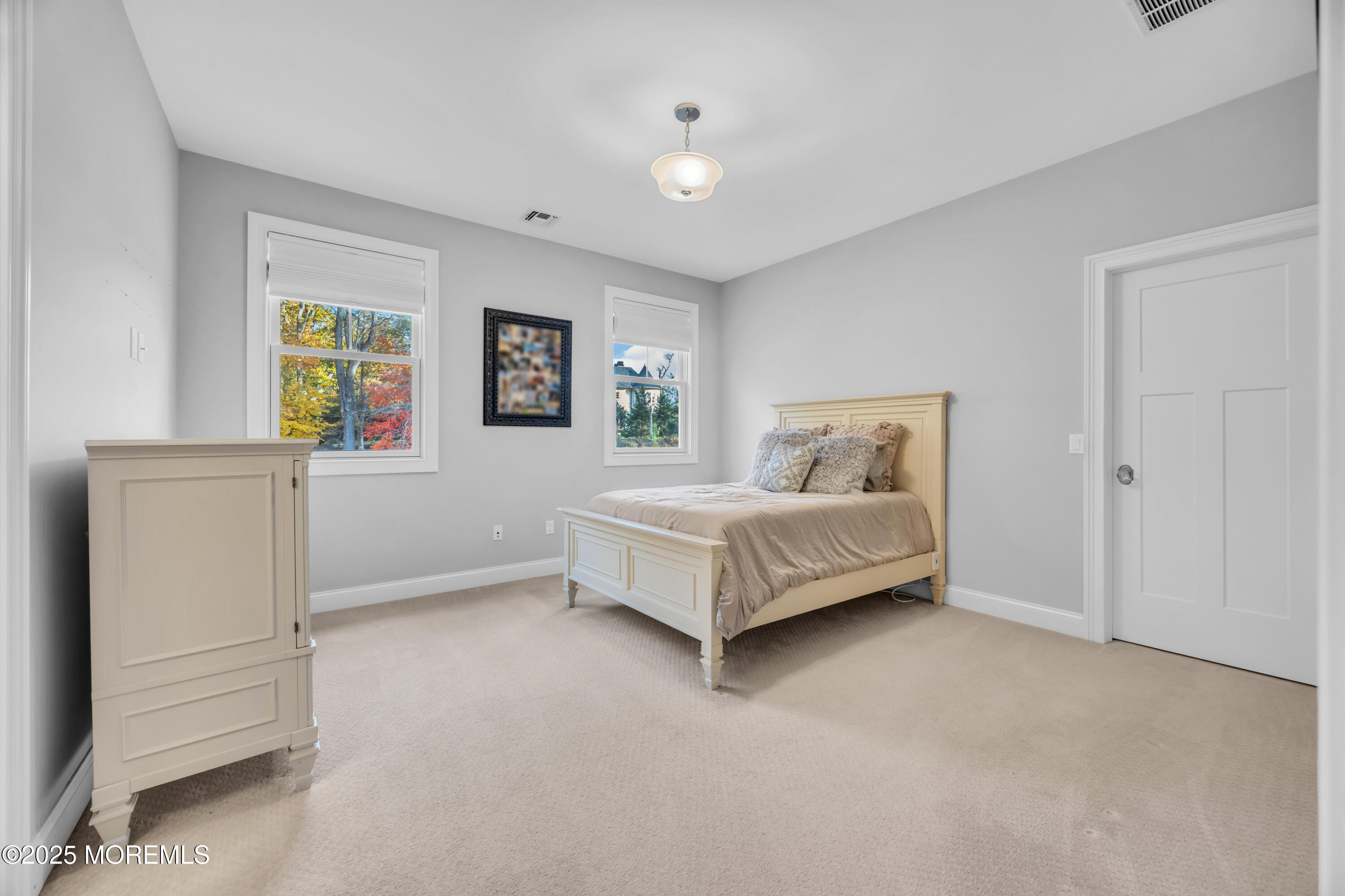 145 Heulitt Road Colts Neck, NJ 07722 - Photo 38 of 59 a bedroom with a bed and window