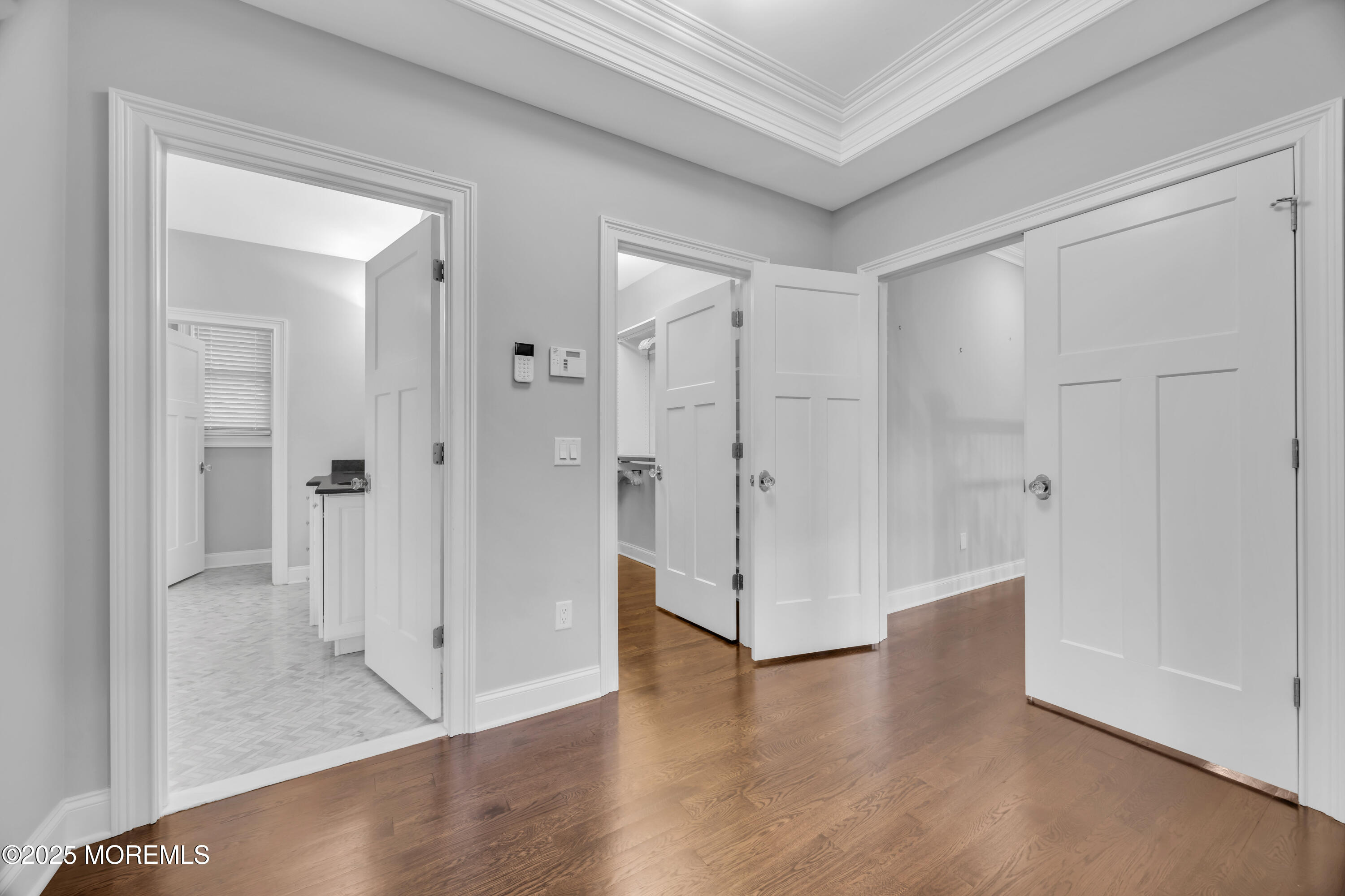 145 Heulitt Road Colts Neck, NJ 07722 - Photo 43 of 59 a view of a hallway with wooden floor