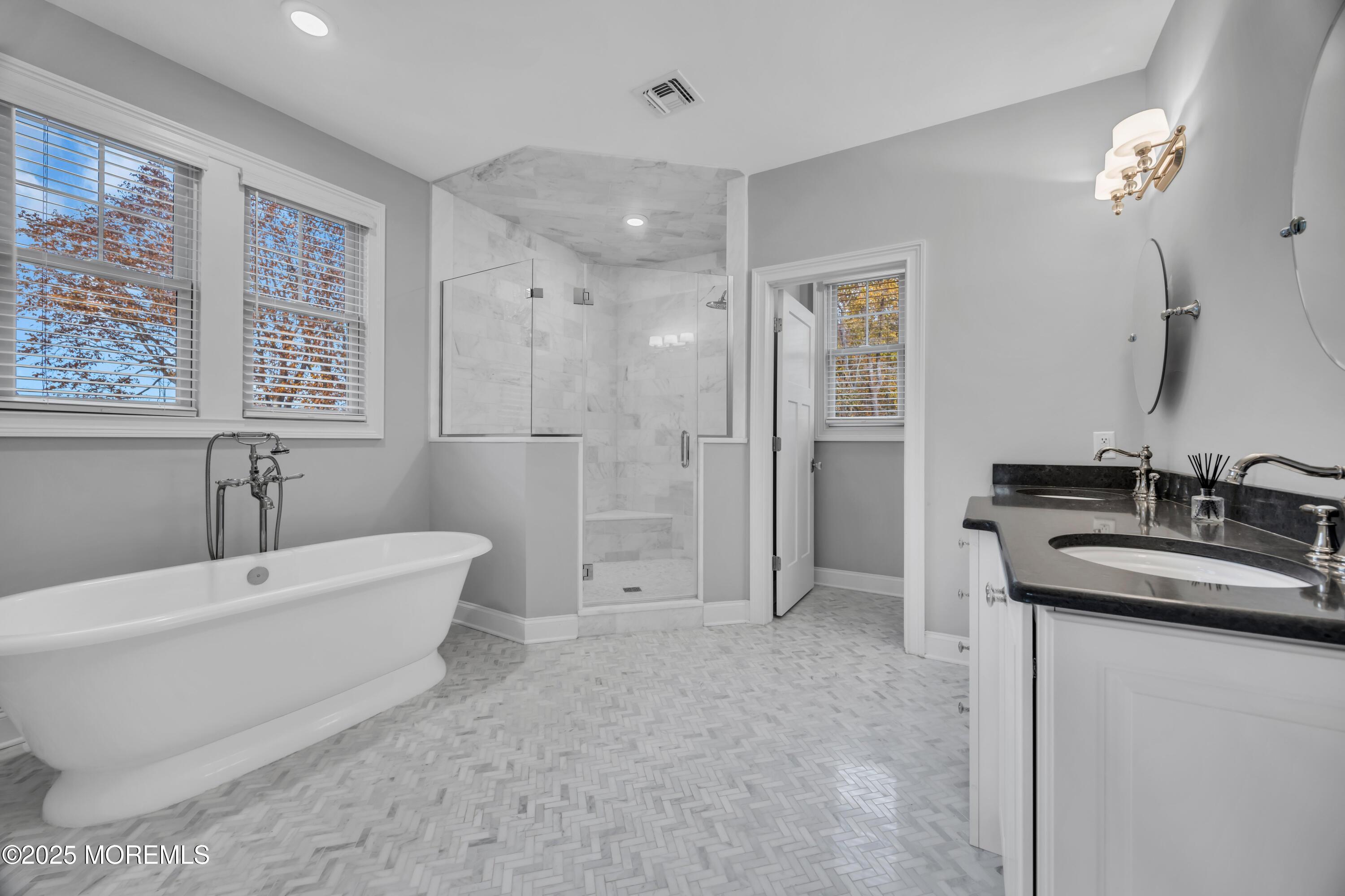 145 Heulitt Road Colts Neck, NJ 07722 - Photo 46 of 59 a bathroom with a bathtub a shower a sink and a large mirror