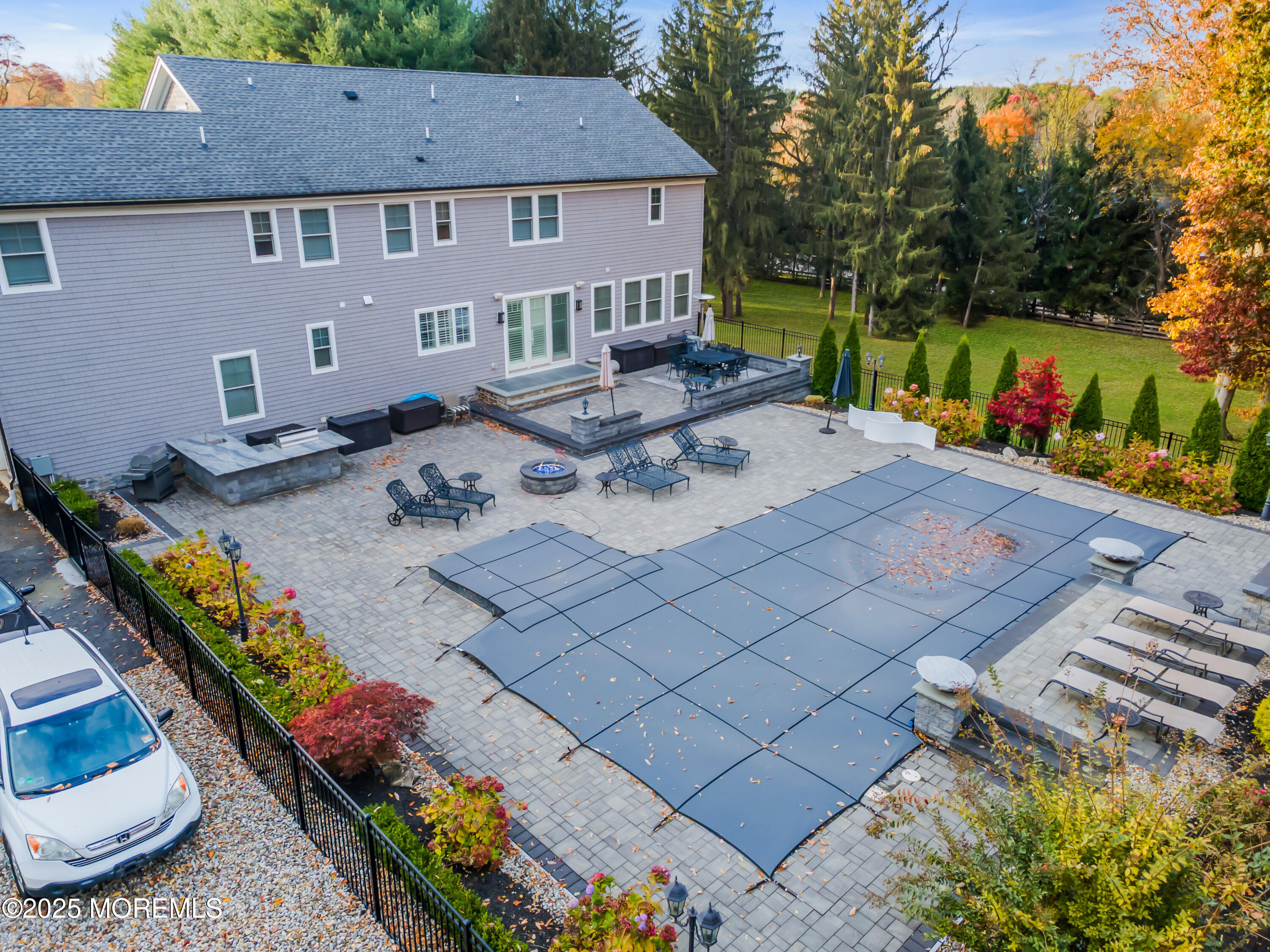 145 Heulitt Road Colts Neck, NJ 07722 - Photo 57 of 59 a view of a patio with table and chairs potted plants