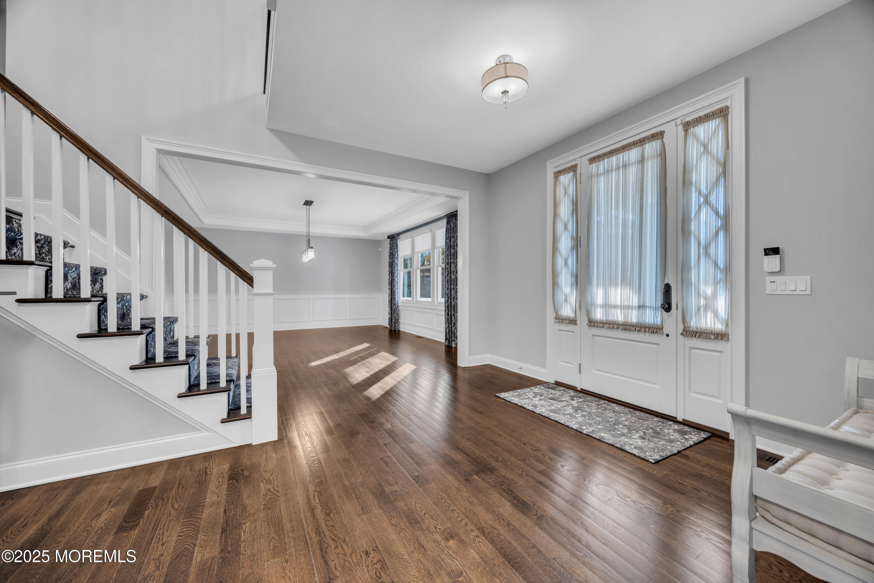 145 Heulitt Road Colts Neck, NJ 07722 - Photo 6 of 59 a view of entryway with wooden floor