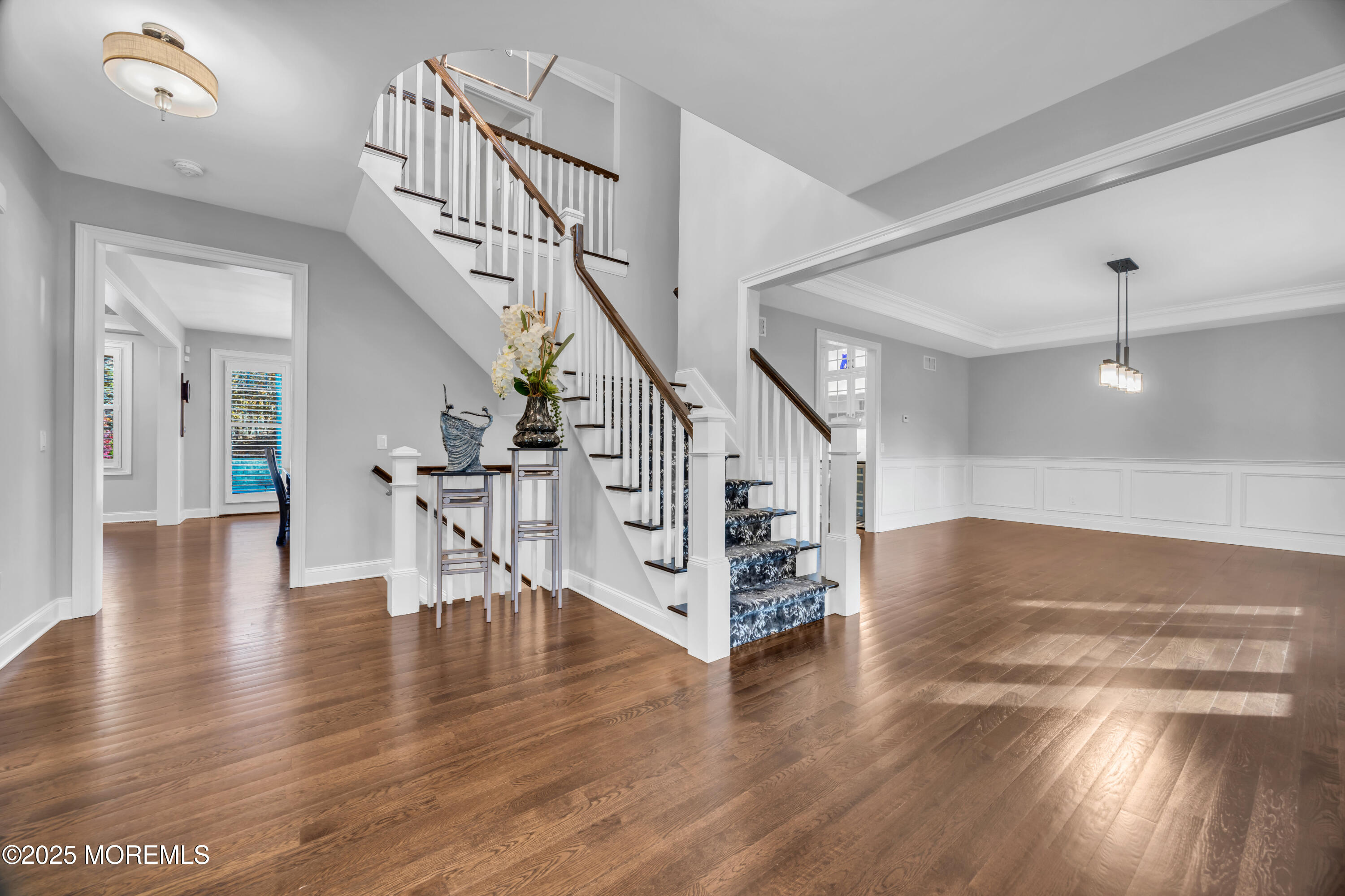 145 Heulitt Road Colts Neck, NJ 07722 - Photo 7 of 59 a view of entryway and hall with wooden floor