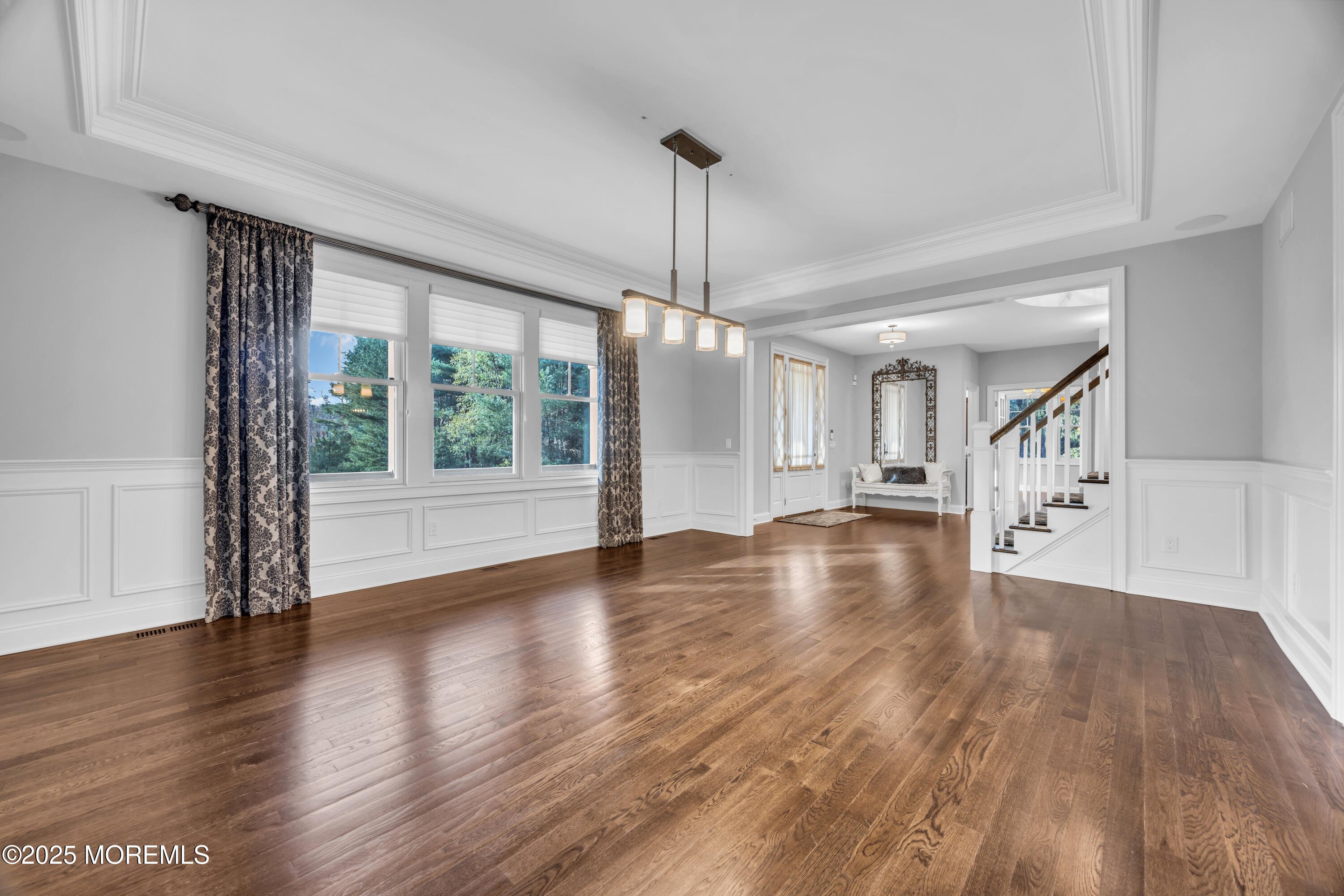 145 Heulitt Road Colts Neck, NJ 07722 - Photo 9 of 59 a view of an empty room with wooden floor and a window