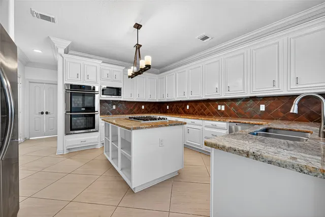a view of a kitchen with sink a stove and dishwasher