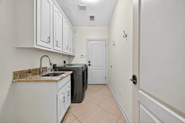 a view of a kitchen with sink a stove and dishwasher