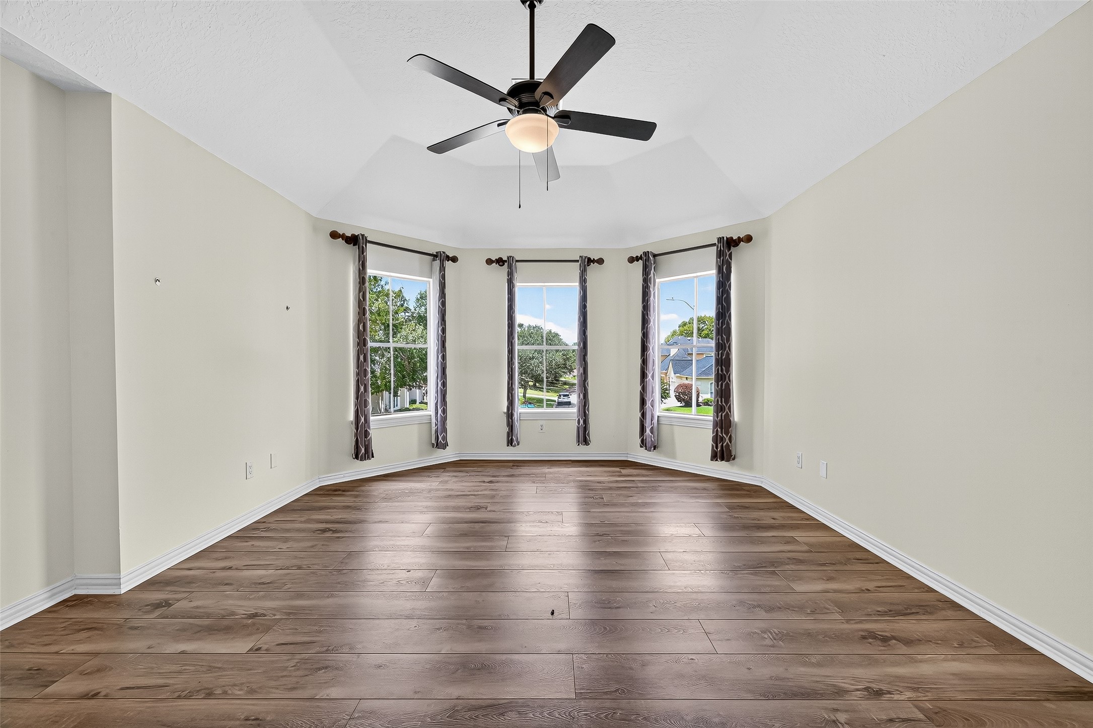 1803 Cottage Landing Lane Houston, TX 77077 - Photo 24 of 50 wooden floor in an empty room with a window