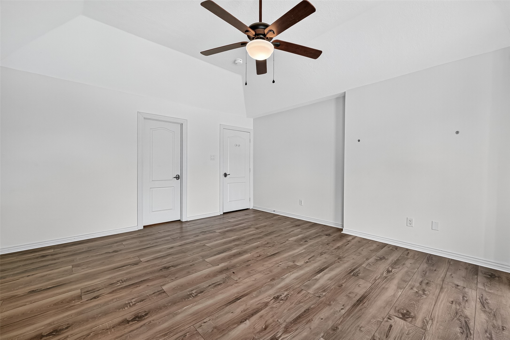 1803 Cottage Landing Lane Houston, TX 77077 - Photo 25 of 50 a view of an empty room with wooden floor