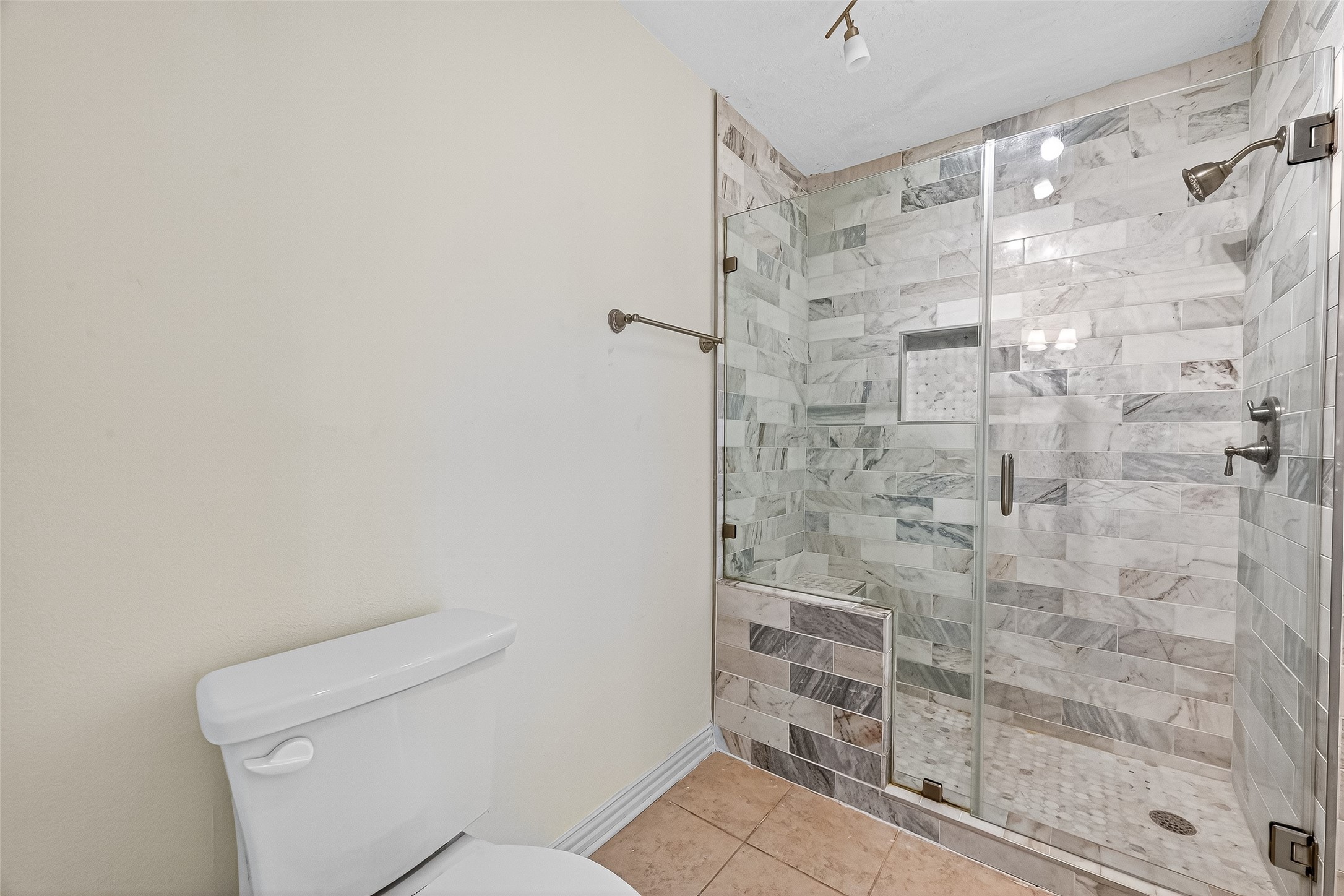 1803 Cottage Landing Lane Houston, TX 77077 - Photo 28 of 50 a bathroom with a shower and toilet
