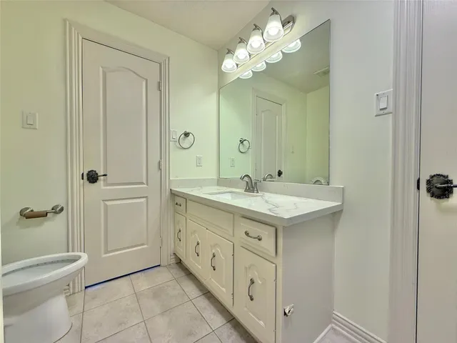 a bathroom with a bathtub and window