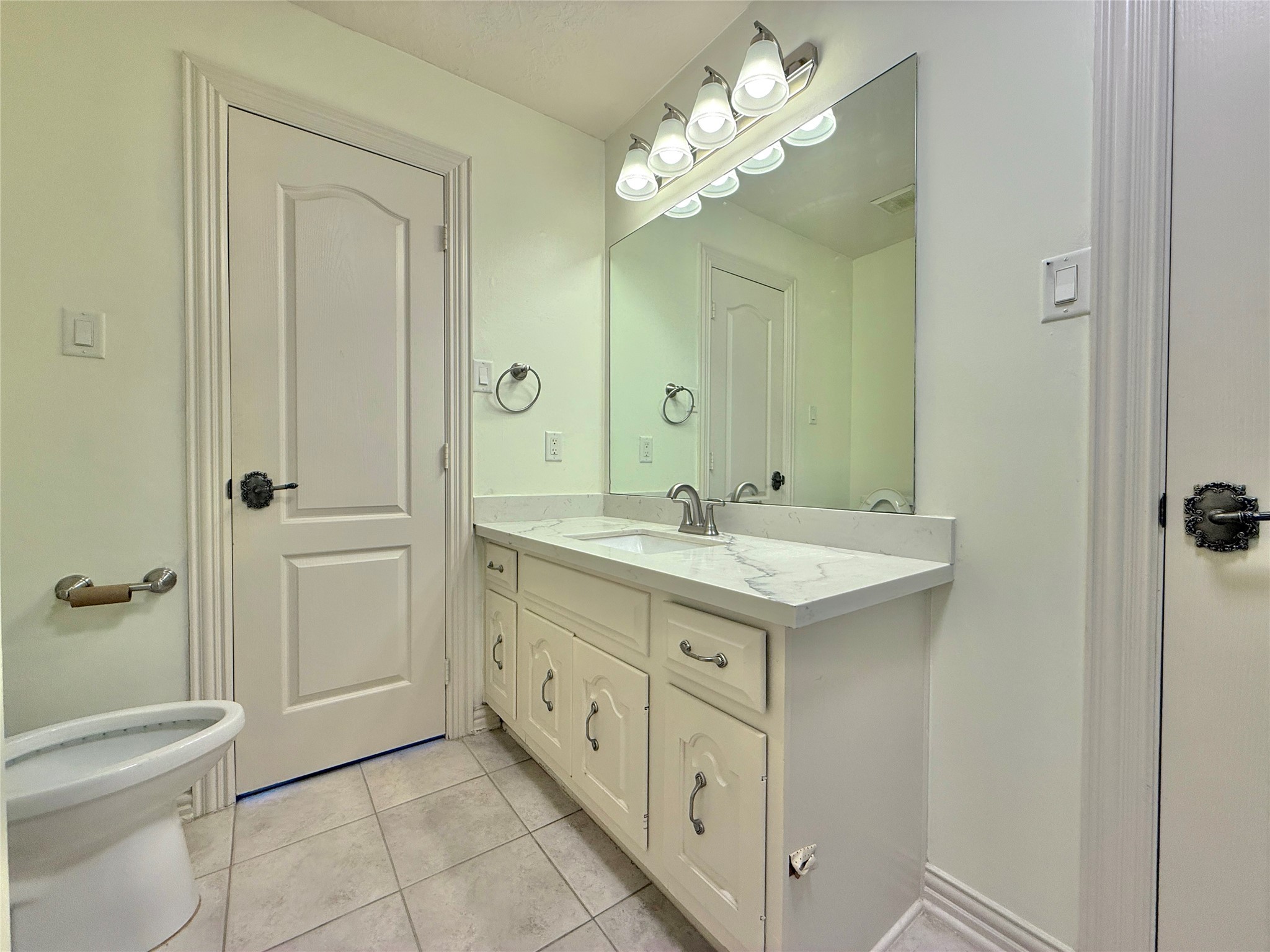 1803 Cottage Landing Lane Houston, TX 77077 - Photo 33 of 50 a bathroom with a granite countertop sink a toilet and shower
