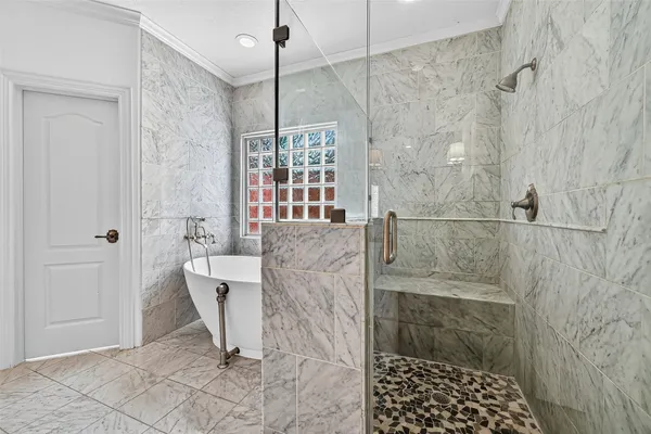 a bathroom with a shower and a sink