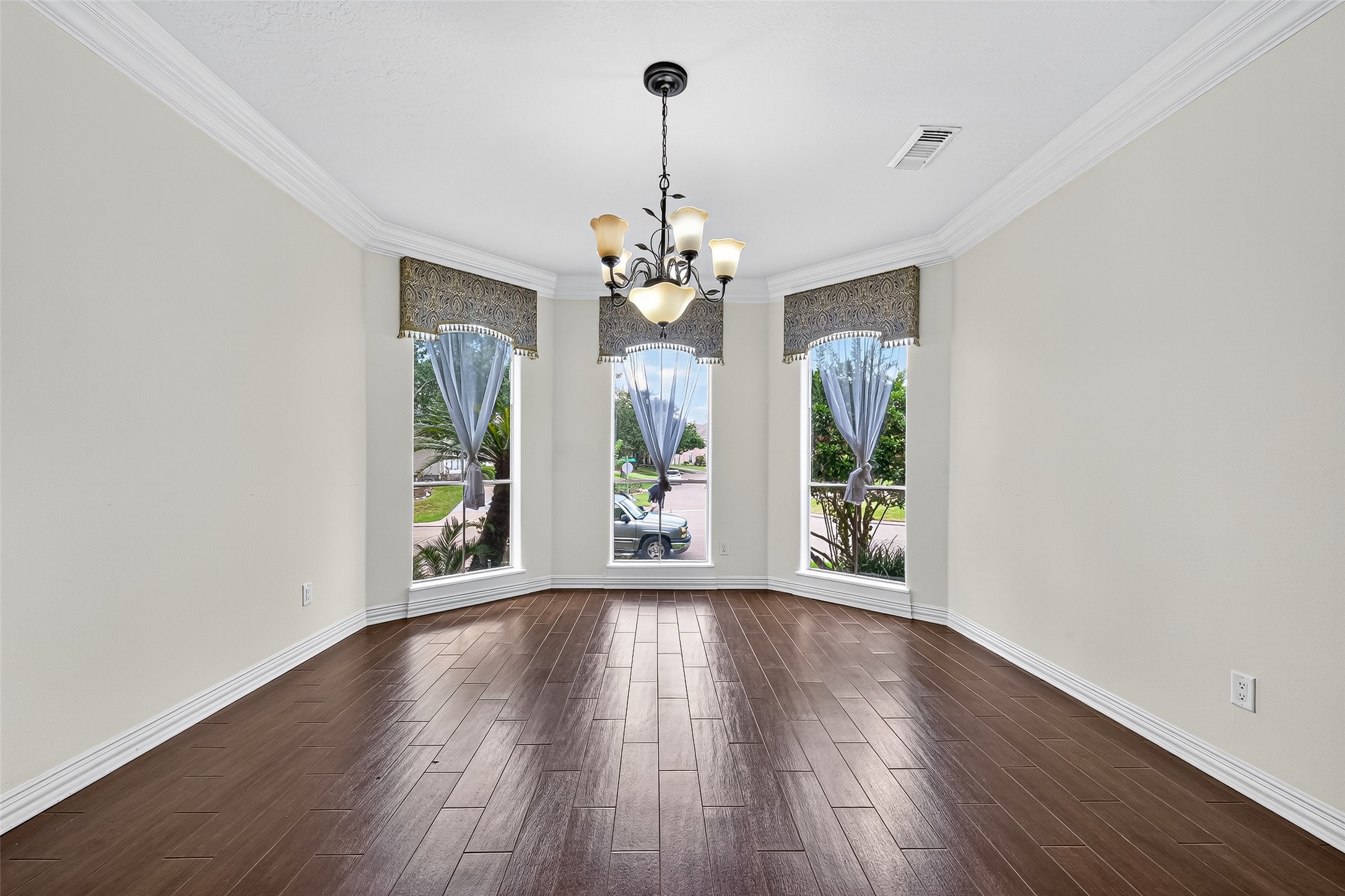 1803 Cottage Landing Lane Houston, TX 77077 - Photo 5 of 50 wooden floor in an empty room with a window