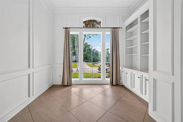a view of an entryway with wooden floor