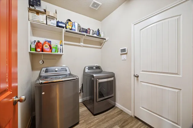 a utility room with dryer and washer