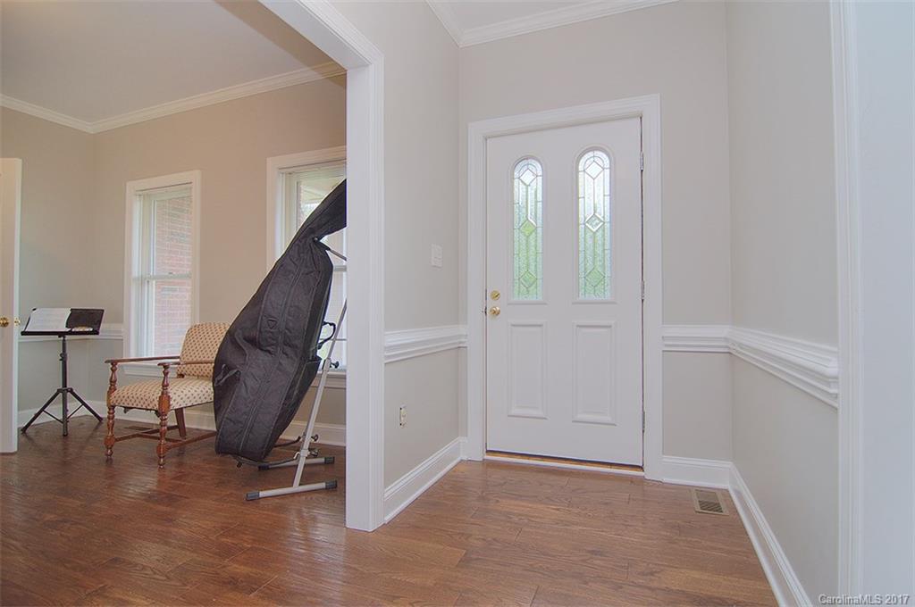 2210 McManus Road Midland, NC 28107 - Photo 23 of 24 an empty room with wooden floor and windows