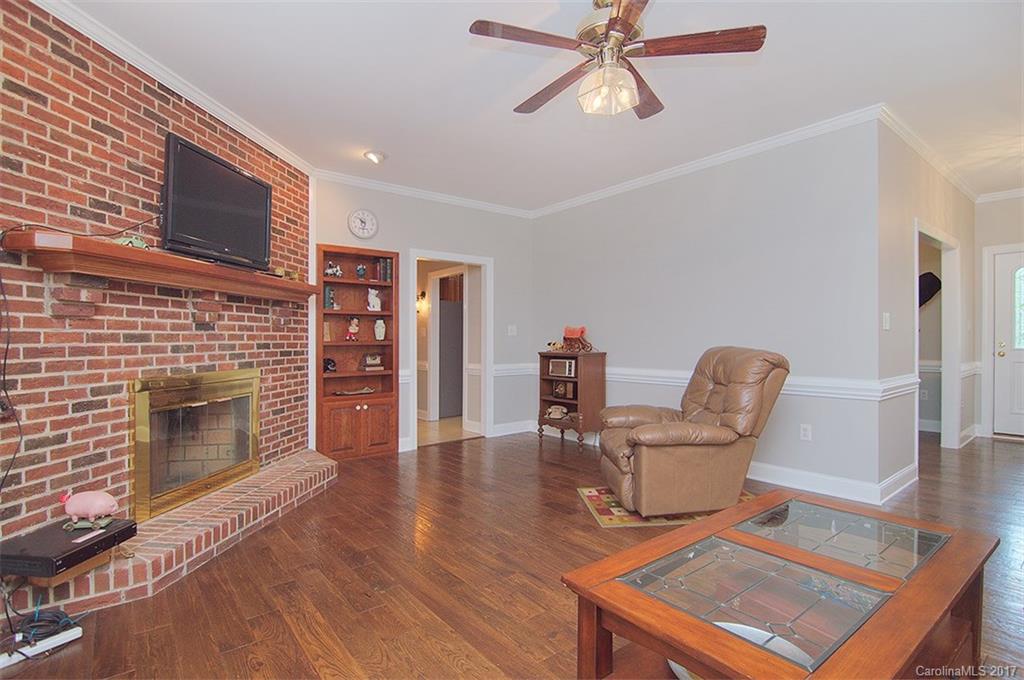 2210 McManus Road Midland, NC 28107 - Photo 7 of 24 a living room with furniture and a fireplace