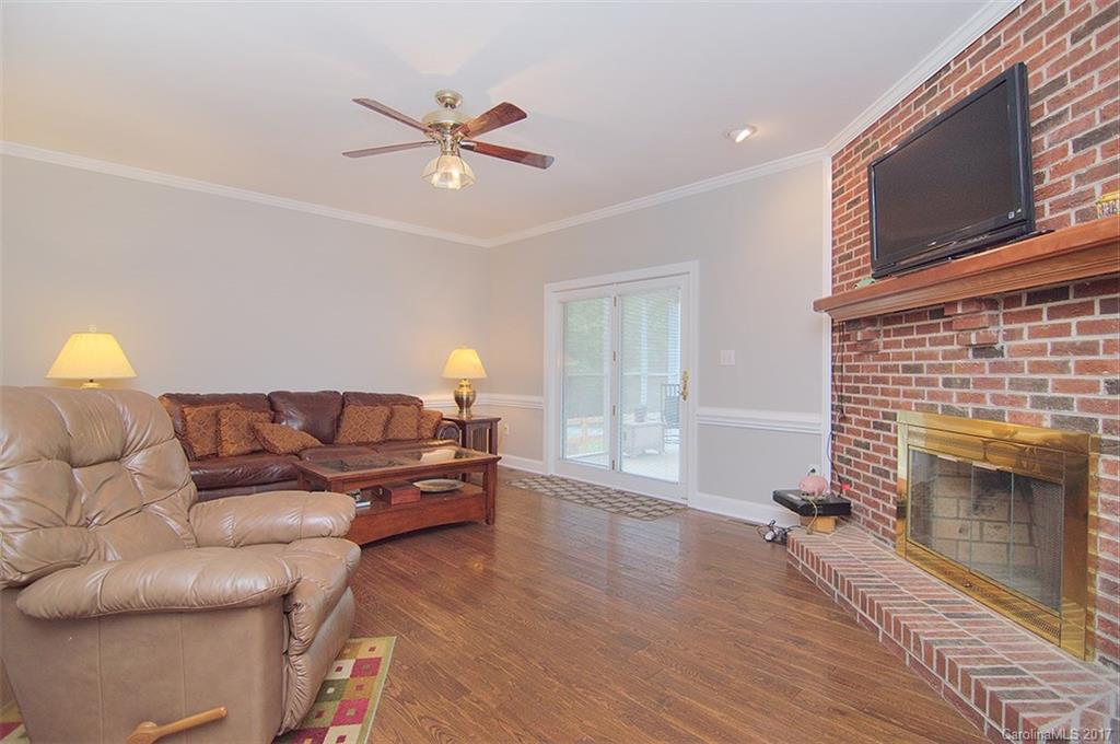 2210 McManus Road Midland, NC 28107 - Photo 9 of 24 a living room with furniture and a fireplace