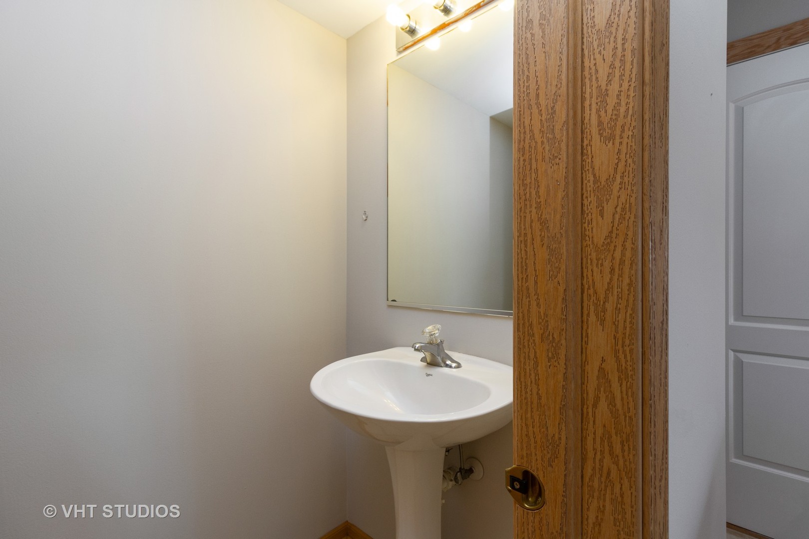 25192 Faraday Road Manhattan, IL 60442 - Photo 12 of 14 a bathroom with a sink and a mirror