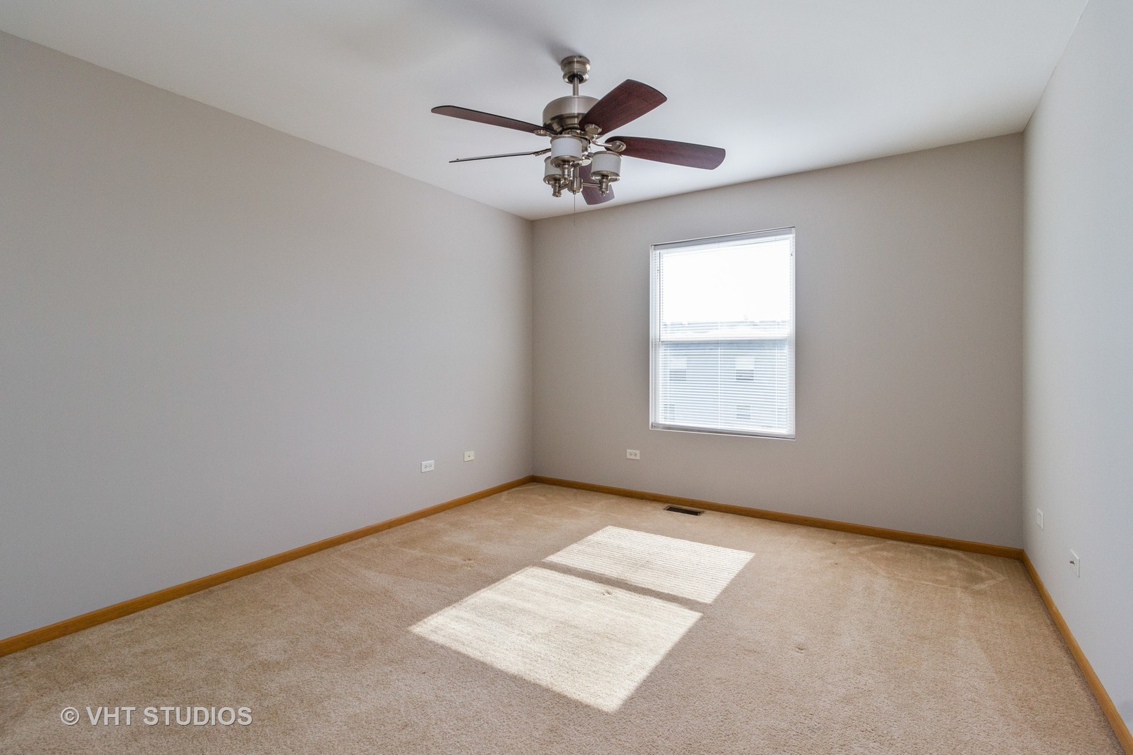 25192 Faraday Road Manhattan, IL 60442 - Photo 8 of 14 an empty room with windows and fan