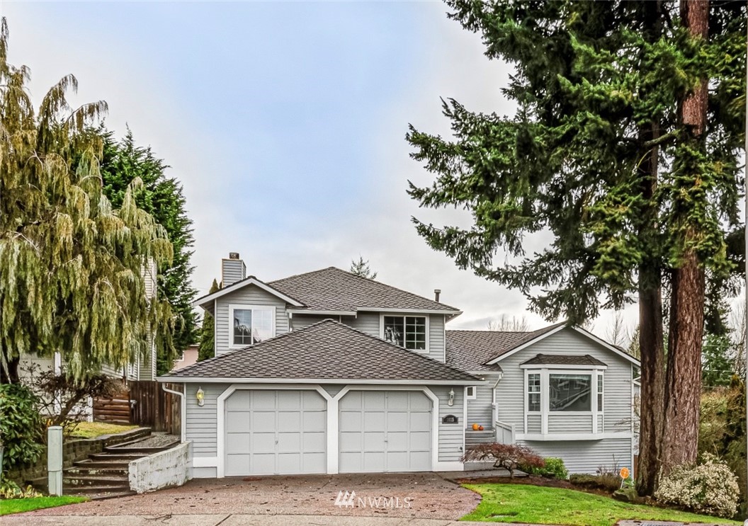 2025 Field Avenue Northeast Renton, WA 98059 - Photo 1 of 23 a front view of a house with a garden and trees