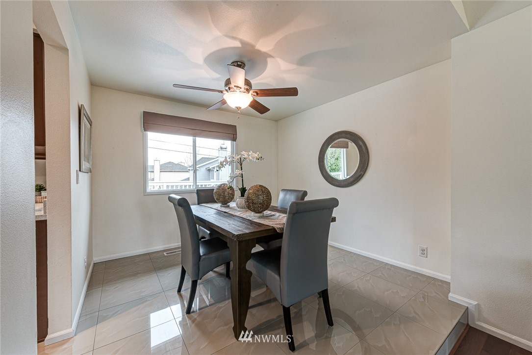2025 Field Avenue Northeast Renton, WA 98059 - Photo 12 of 23 a view of a dining room with a table and a chandelier