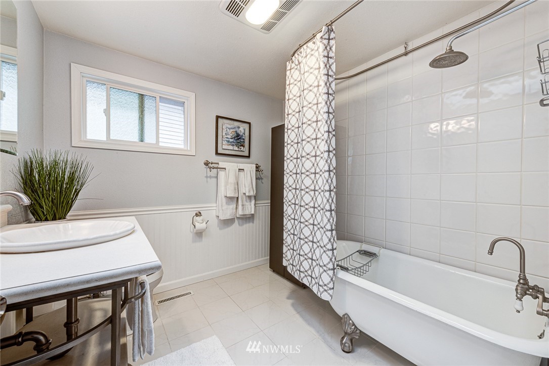 2025 Field Avenue Northeast Renton, WA 98059 - Photo 17 of 23 a bathroom with a bathtub a sink and a shower