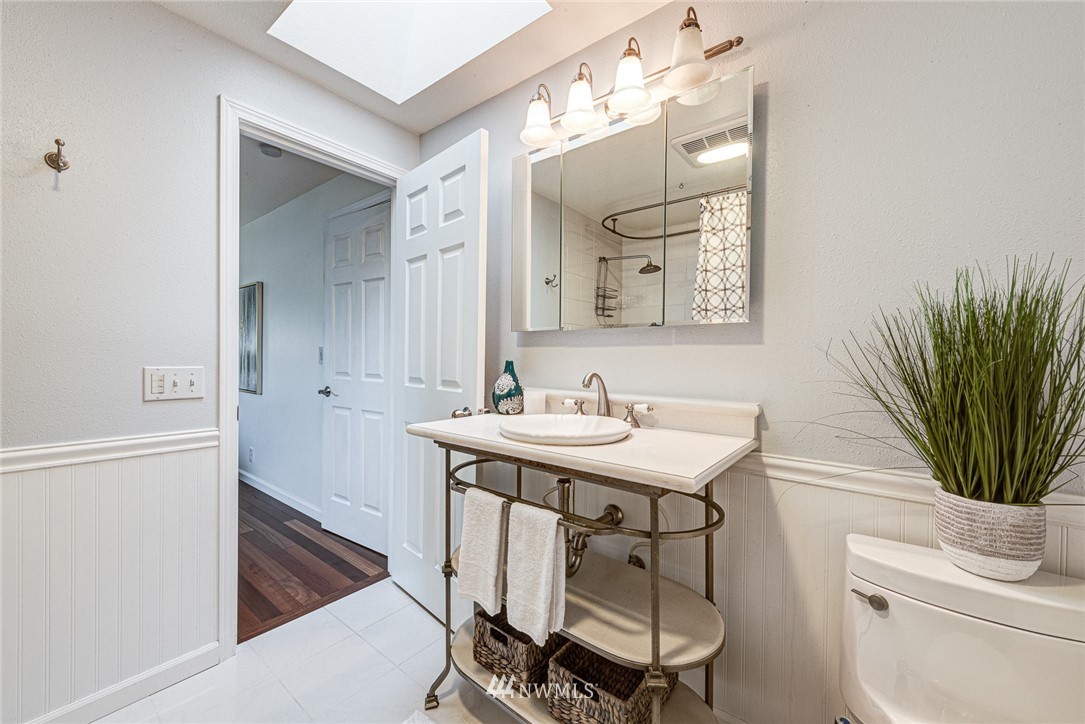 2025 Field Avenue Northeast Renton, WA 98059 - Photo 18 of 23 a bathroom with a sink a toilet and a mirror