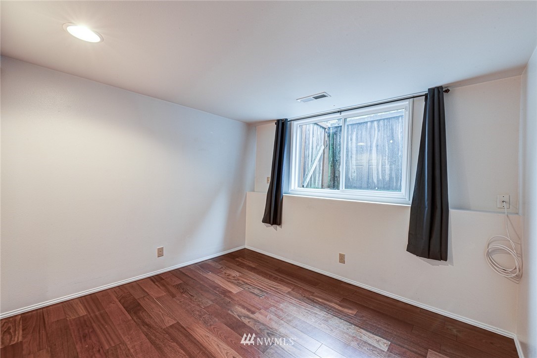 2025 Field Avenue Northeast Renton, WA 98059 - Photo 6 of 23 wooden floor in an empty room with a window