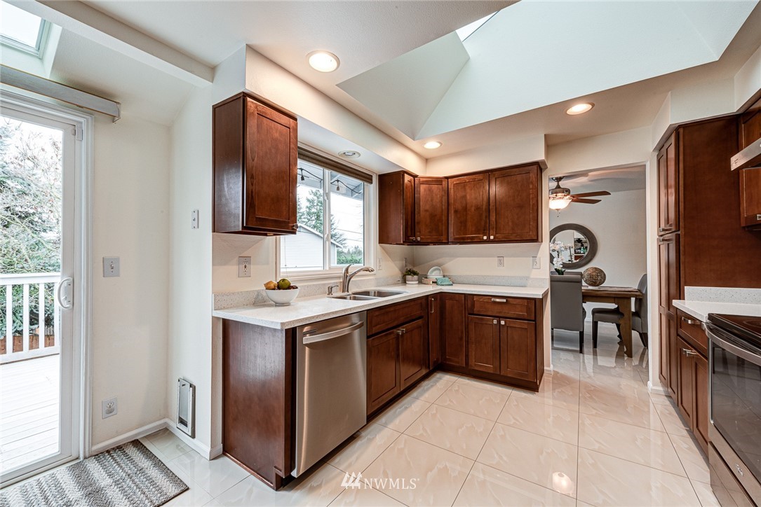 2025 Field Avenue Northeast Renton, WA 98059 - Photo 10 of 23 a kitchen with a stove sink and a microwave