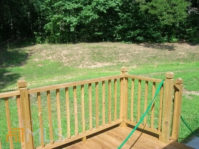a view of a car parked in the grass