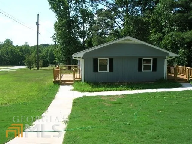 a house view with a garden space