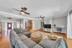 a living room with furniture and a flat screen tv