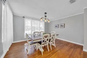 a view of a dining room with furniture and window
