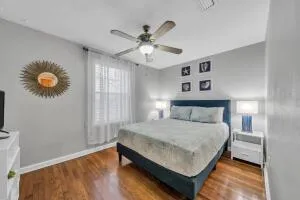 a bedroom with a bed and a chandelier