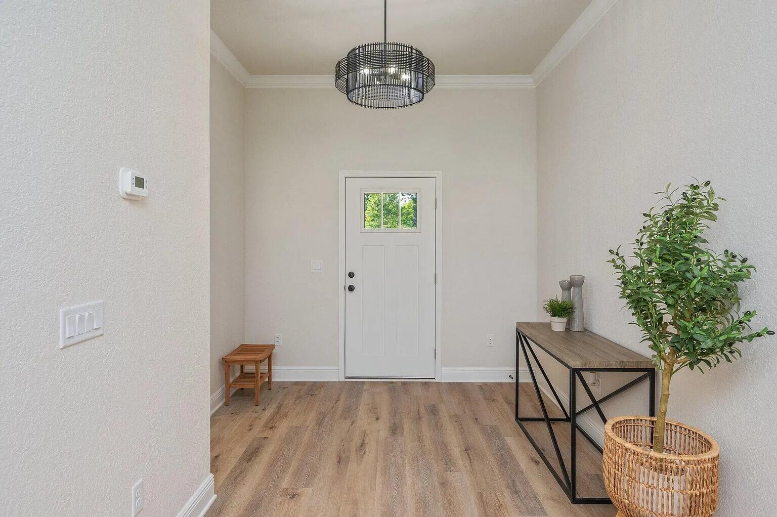 693 Bowers Avenue East Crestview, FL 32539 - Photo 13 of 27 a view of workspace with wooden floor and potted plant