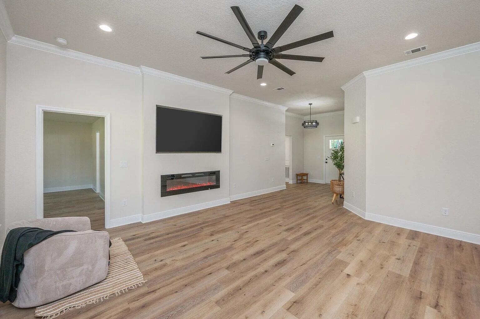 693 Bowers Avenue East Crestview, FL 32539 - Photo 14 of 27 a bedroom with a bed and a flat screen tv