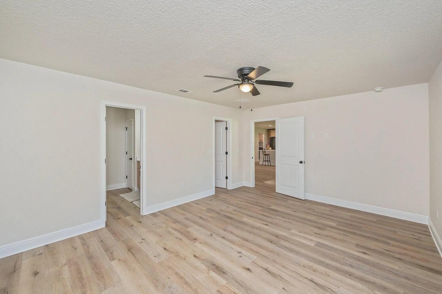 693 Bowers Avenue East Crestview, FL 32539 - Photo 15 of 27 a view of an empty room with wooden floor