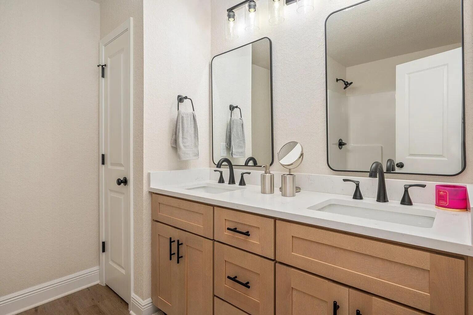 693 Bowers Avenue East Crestview, FL 32539 - Photo 20 of 27 a bathroom with double vanity sink and a mirror