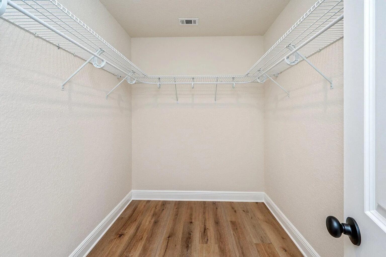 693 Bowers Avenue East Crestview, FL 32539 - Photo 22 of 27 a view of a room with racks on the wall