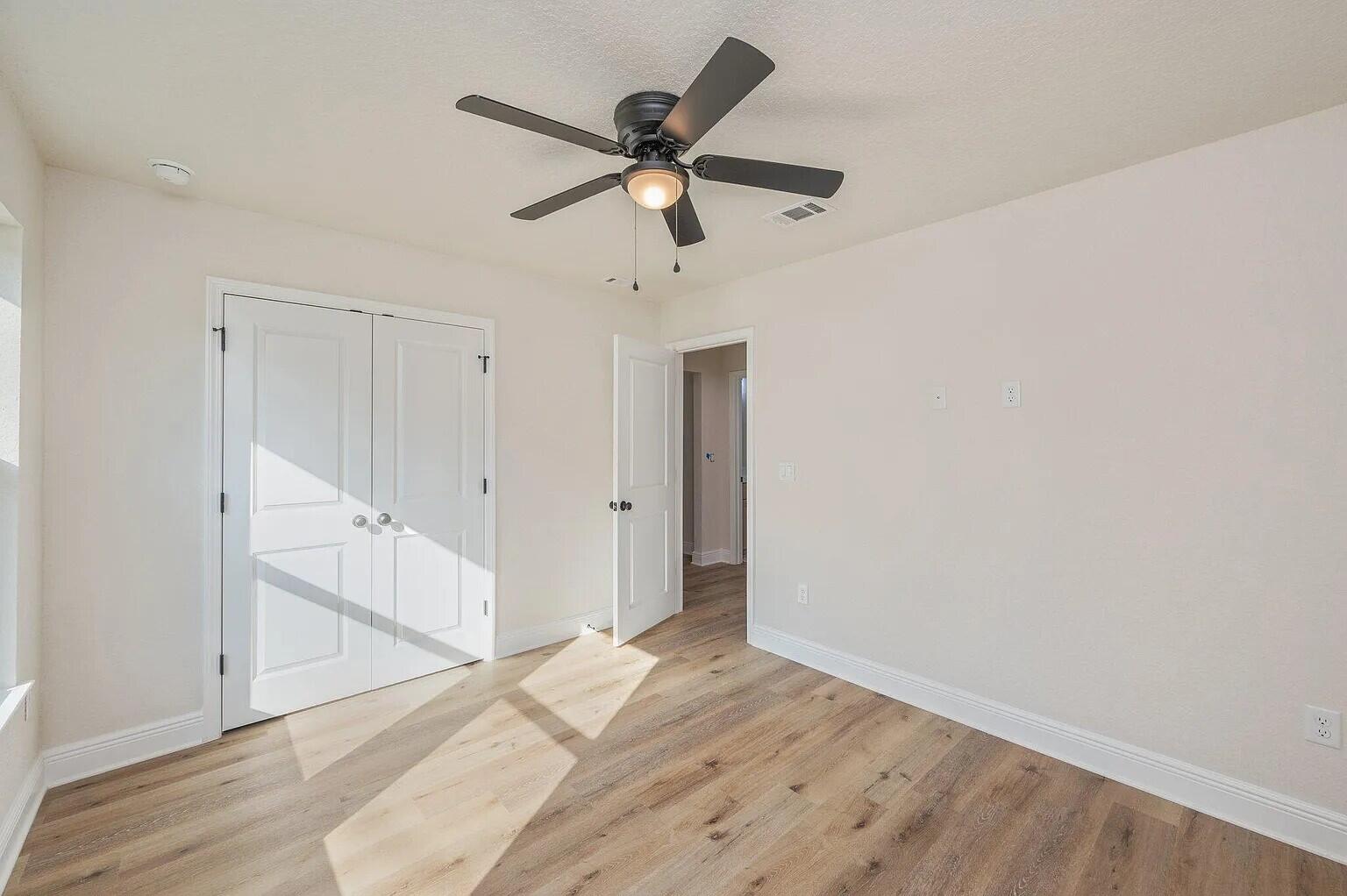 693 Bowers Avenue East Crestview, FL 32539 - Photo 23 of 27 a view of empty room with wooden floor