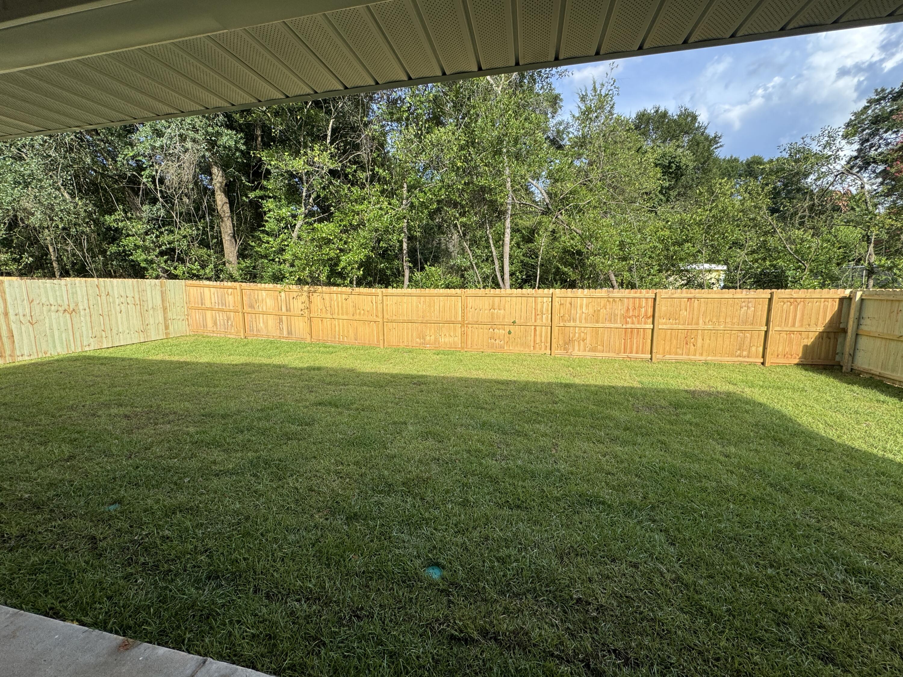 693 Bowers Avenue East Crestview, FL 32539 - Photo 3 of 27 a view of yard with swimming pool and outdoor seating