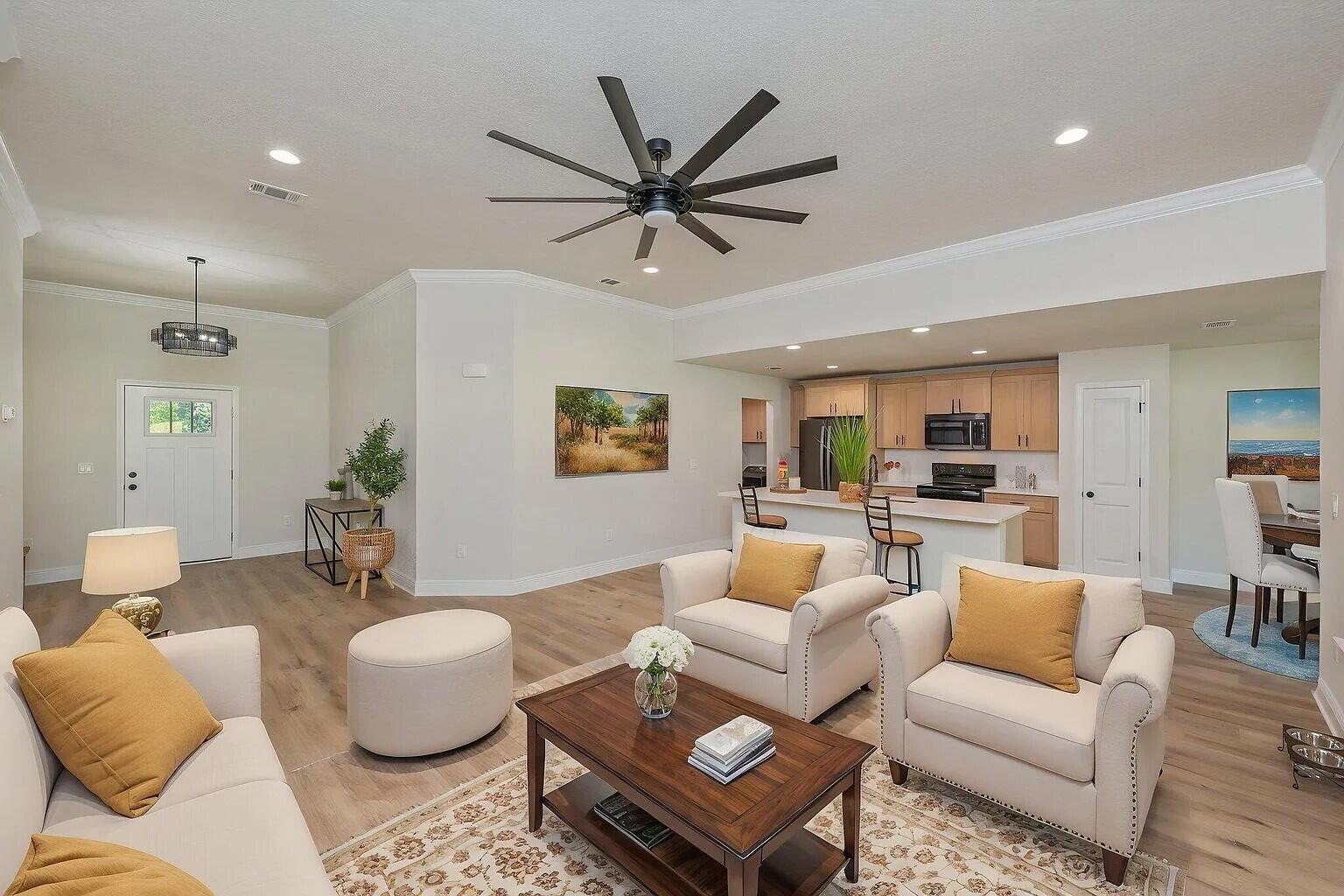 693 Bowers Avenue East Crestview, FL 32539 - Photo 5 of 27 a living room with furniture a view of bedroom and a window