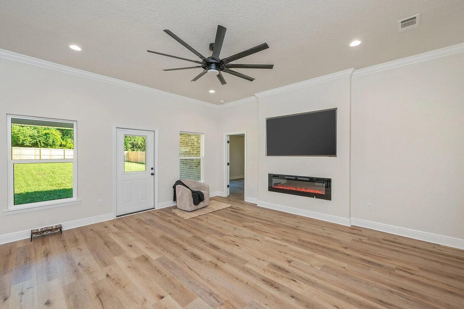 693 Bowers Avenue East Crestview, FL 32539 - Photo 8 of 27 a room with a bed and a flat screen tv